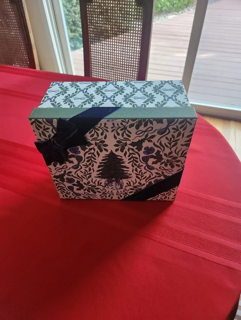 Martha Stewart Christmas gift box with navy and green floral and ribbon design